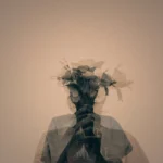 Blurry profile of an individual holding flowers, illustrating overthinking in a relationship and the mental fog of relationship anxiety.